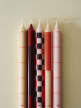 Pattern Candle, set of 4, reds and bordeaux